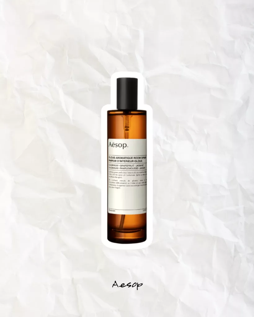 Aesop room spray in an amber glass bottle styled as minimalist home fragrance décor.