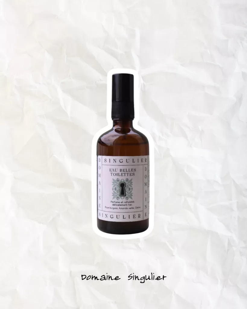 Domaine Singulier room spray bottle photographed as artisanal home fragrance décor.