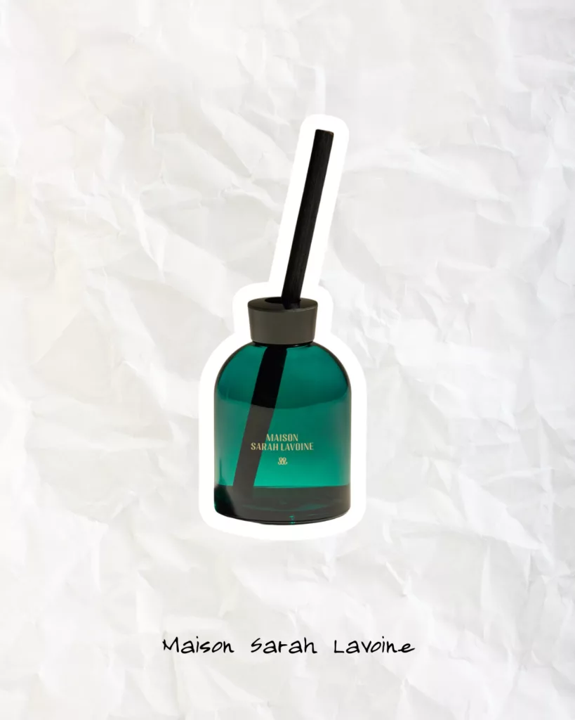 Maison Sarah Lavoine home fragrance bottle in deep green glass, styled as luxury scented décor.