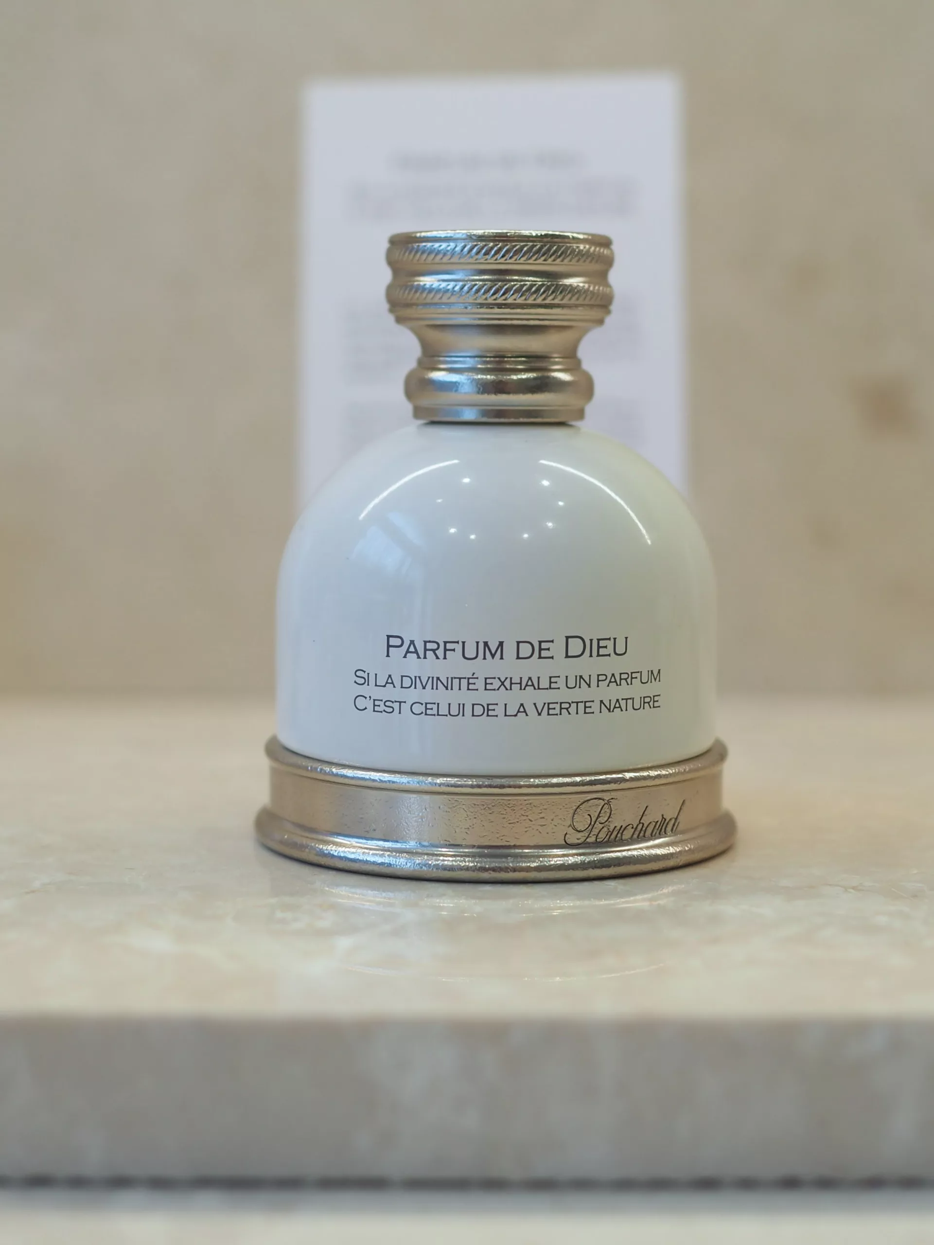 The niche perfume Pouchard in a glass bottle with silver-plated details